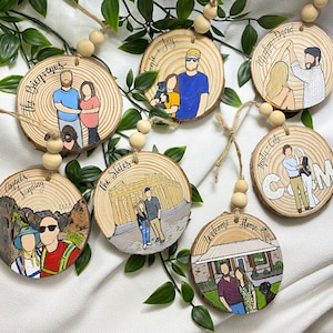 May include: Set of ten round wooden ornaments with painted images and text. The ornaments feature couples, dogs, and scenes from different locations. The text on the ornaments includes names, dates, and locations.