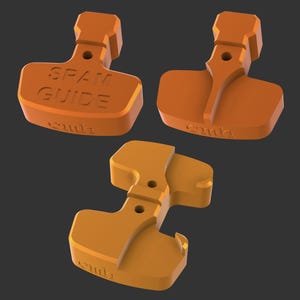 Könnte beinhalten: Drei orangefarbene SRAM GUIDE Bremsscheiben-Abstandshalter. Ein Abstandshalter trägt den Text "SRAM GUIDE" und den Markennamen "cmla". Die anderen beiden haben ein einzigartiges Design. Alle drei auf dunklem Grauton.