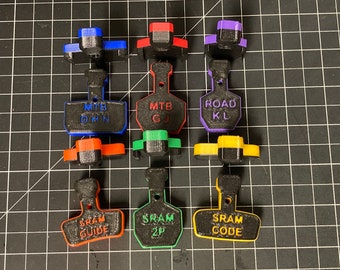 Top loading brake bleed and piston exposure blocks for disc calipers