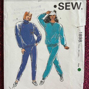May include: Sewing pattern for a two-piece outfit, featuring a long-sleeved top and pants. The pattern is for sizes XS-S-M-L and is from Kwik Sew Pattern Co., Inc. The pattern shows two models wearing the outfit in different colors, one in blue and one in turquoise.