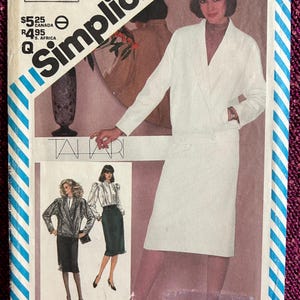 May include: Vintage Simplicity sewing pattern featuring a woman in a white suit. The pattern number is 6106, size 14, with measurements in inches. The cover also shows illustrations of other outfit options.