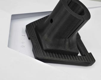 May include: A black plastic 3D printed adapter with a 45mm diameter opening. The adapter has a square base with a textured surface.