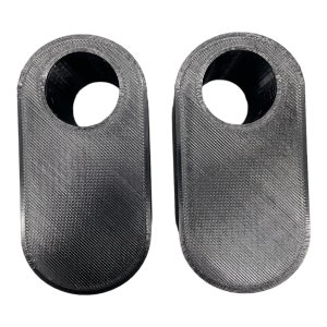 May include: Two gray, 3D-printed, oval-shaped objects with a hole at the top. The objects have a textured surface with diagonal lines. The background is white.