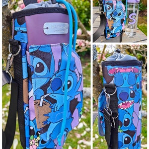 May include: A water bottle carrier with a blue and purple Stitch cartoon design. The carrier has a black adjustable strap, a purple top, and a teal drawstring. A clear water bottle with a purple lid is also visible.