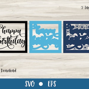 May include: Two-layer digital cut file for a happy birthday card. The top layer features the words "happy birthday" in a black script font. The bottom layer features a blue floral design.