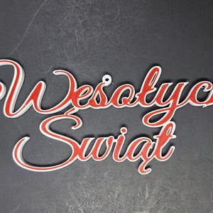 May include: White and red cursive lettering that reads "Wesołych Świąt" which is Polish for "Merry Christmas".