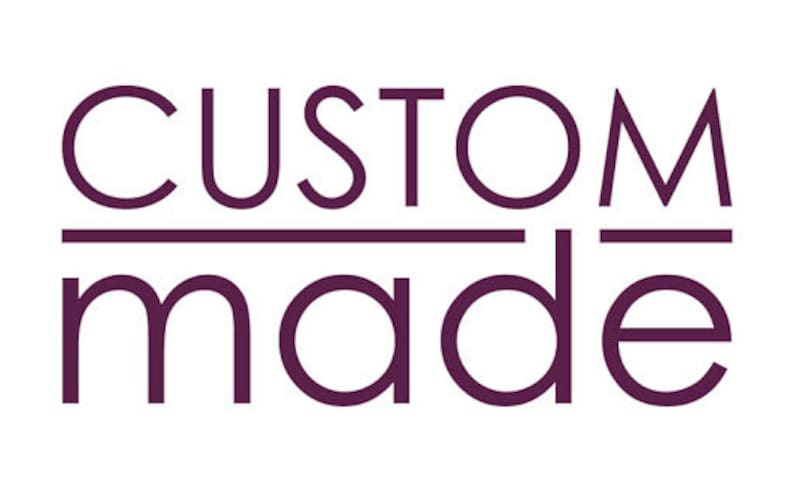May include: The words "CUSTOM MADE" are displayed in a dark purple font on a white background. The word "CUSTOM" is above the word "MADE", with a horizontal line separating the two words.