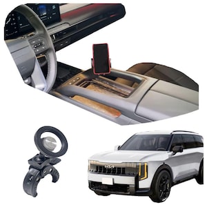 May include: A car interior with a mounted smartphone and a steering wheel spinner. A white SUV is also shown. The phone is held in a red holder. The steering wheel spinner is black and silver.