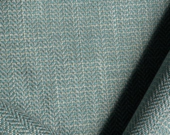 May include: Close-up of a teal and white woven fabric with a herringbone pattern.