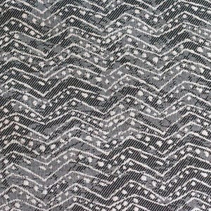 Tessuto per serre a zig-zag color granito, grigio, nero e crema, tagliato su misura.