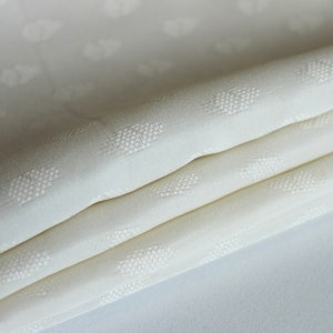 Ivory abstract pattern semi-sheer fabric by the yard