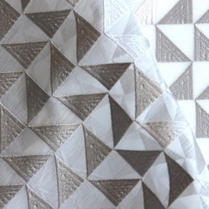 Sheer fabric with pewter geometric triangle detail sold by the yard