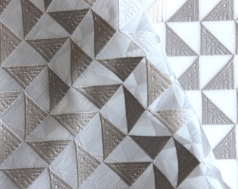 Sheer fabric with pewter geometric triangle detail sold by the yard