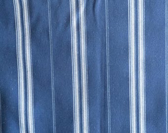 May include: Blue and white striped fabric with a woven texture.