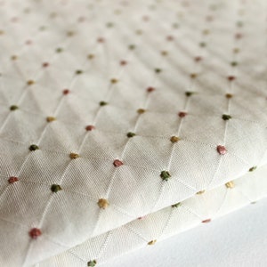 Cream diamond patterned fabric by the yard