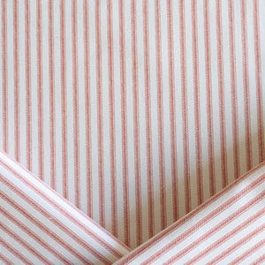 Designer high-end red-orange and white ticking stripe upholstery fabric by the yard