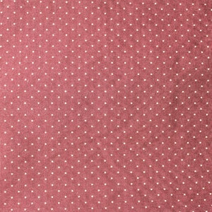 May include: A close-up of a red fabric with a white polka dot pattern.