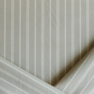 Light gray-green striped upholstery fabric by the yard