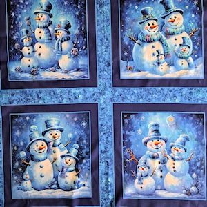 May include: A fabric panel with four squares, each showing a winter scene with snowmen. The snowmen wear top hats and scarves, with twig arms, set against a snowy, blue background. The panel has a blue border.