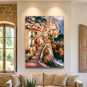 Peut inclure: Une impression d'art mural verticale représentant un village méditerranéen à flanc de colline avec des bâtiments en pierre, un escalier sinueux et un clocher, dans des tons chauds orange, jaune et vert. Le tableau montre un chemin montant.