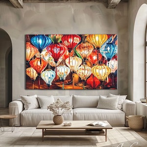 May include: A large rectangular wall art print featuring a vibrant collection of glowing paper lanterns in shades of red, blue, yellow, and orange. The lanterns are arranged in a dense, overlapping composition, each emitting a warm, soft light against a dark background.