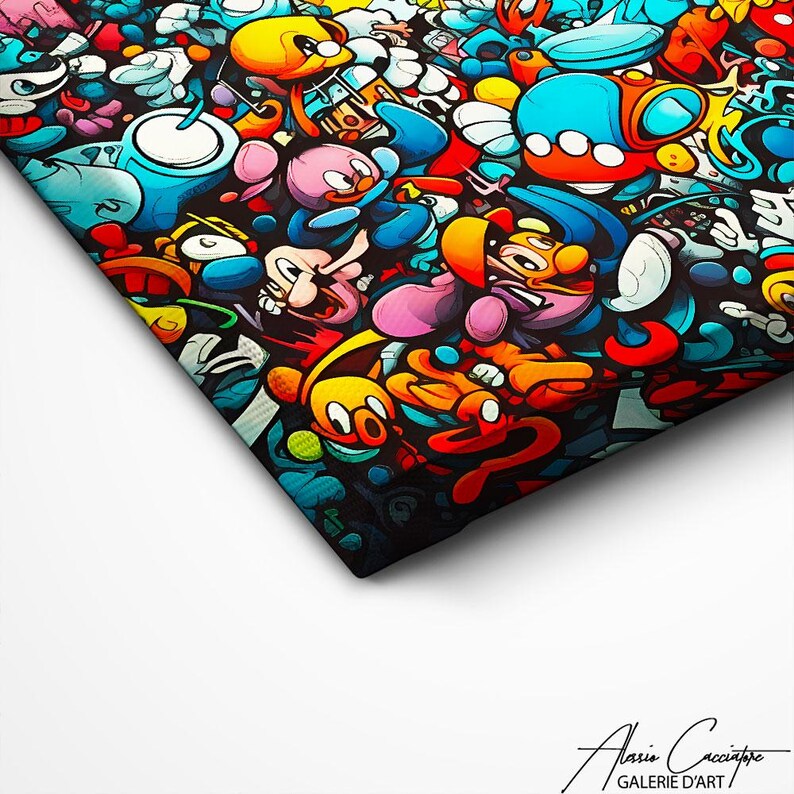 May include: A canvas print featuring a dense, colorful graffiti-style collage of cartoon characters in shades of blue, yellow, red, and pink against a black background. The bottom right corner displays the text Alasio Cacciatore GALERIE D'ART.