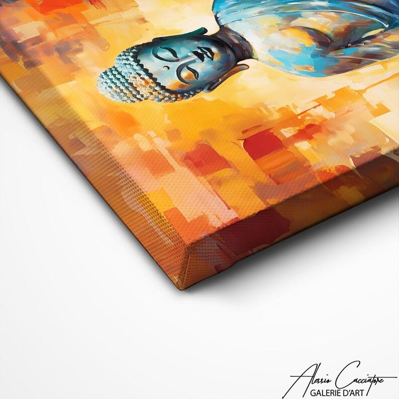 May include: A canvas print depicting a Buddha head in blue, orange, and yellow hues. The artwork shows a calm Buddha with closed eyes, set against an abstract background. The canvas is stretched and ready to hang.