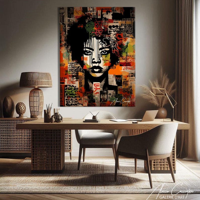 May include: A striking piece of art depicting a woman's face with a collage background of text and images. The colour palette includes orange, red, and black. The artwork is displayed in a modern office setting, with a wooden desk and chairs.