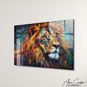 May include: A colorful abstract painting of a lion's head with a splash of color background. The lion's mane is a mix of orange, yellow, and red. The lion's eyes are a bright yellow. The background is a mix of blue, green, and purple.