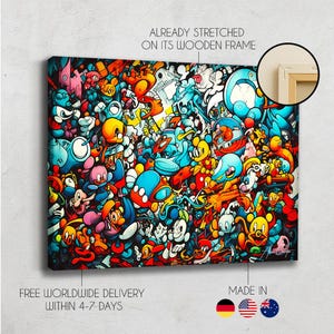 May include: A rectangular canvas print featuring a dense, colorful graffiti-style illustration with overlapping cartoon characters in shades of blue, orange, yellow, and red. The text ALREADY STRETCHED ON ITS WOODEN FRAME appears above a circular inset.
