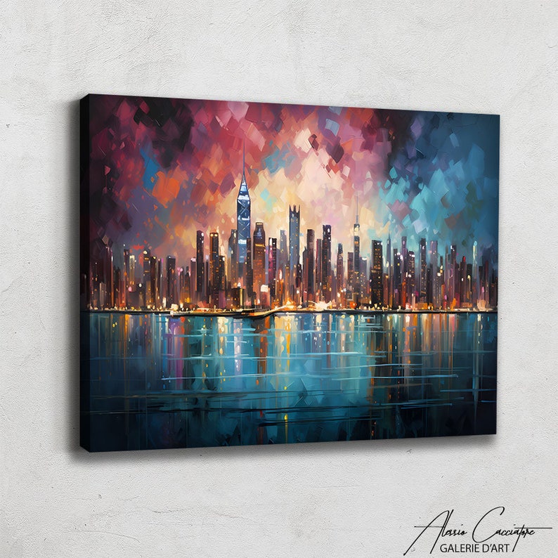 NYC skyline canvas print featuring a stunning panoramic view of Manhattan's illuminated skyscrapers at night reflected on a calm teal water surface, set beneath a dramatic mosaic-style expressionist sky of deep red, purple, rose and electric blue palette knife brushstrokes creating a vibrant jewel-toned canopy above the glittering city lights. Bold cubist-inspired painting style with rich multicolored tones on a dark background. Premium fine art canvas handcrafted in Germany.