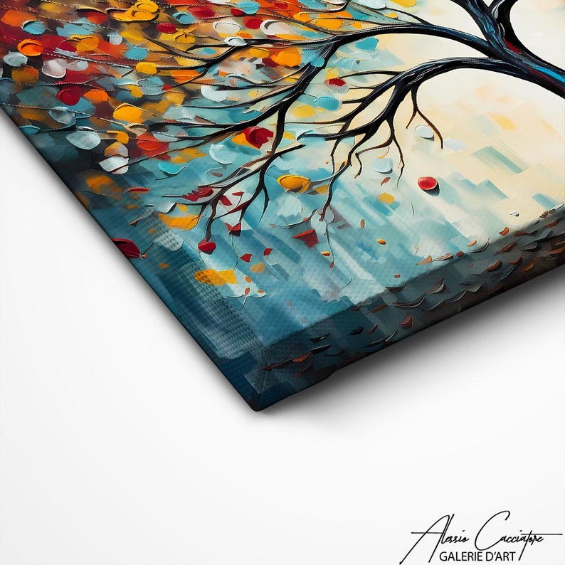 May include: A close-up of a canvas art print featuring a tree with black branches and colorful leaves in shades of red, orange, yellow, and blue. The artwork has a textured, impressionistic style. The artist's signature is visible in the bottom right corner.