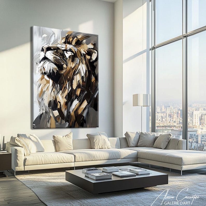 May include: Large abstract painting of a lion's head in shades of brown, black, and white. The artwork is displayed on a white wall above a white sectional sofa in a modern living room setting. The lion is looking upwards.