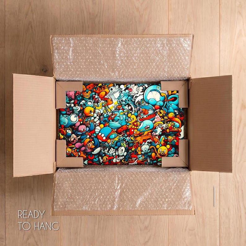 May include: A rectangular wall art piece featuring a dense, colorful collage of cartoon-style characters in shades of blue, orange, red, and yellow, securely packaged inside an open cardboard shipping box with protective bubble wrap and corner guards.