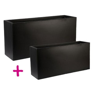 May include: Two black rectangular planters, one larger than the other. The planters are made of a smooth, matt material.