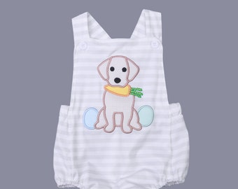 May include: Three different styles of baby clothes featuring a white and gray striped pattern with an embroidered dog holding a carrot. The first outfit is a short-sleeved onesie with a ruffle trim. The second outfit is a sleeveless onesie with straps. The third outfit is a short-sleeved t-shirt with matching green shorts. The text "High Cotton Magnolias" is visible in the image.