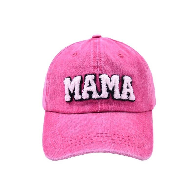 May include: Pink baseball cap with the word "MAMA" in white fluffy letters with black outlines.