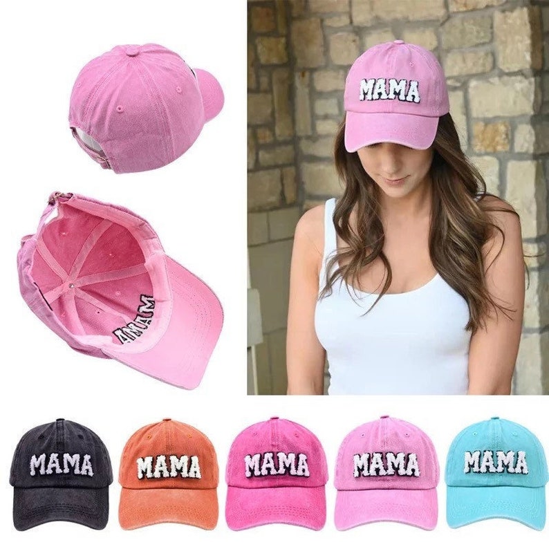 May include: Six baseball caps in different colors with the word "MAMA" embroidered on the front. The caps are pink, orange, black, blue, and light pink.