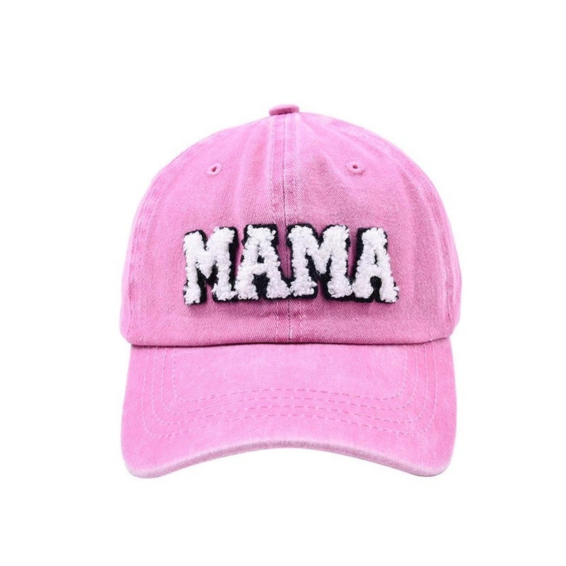 May include: Pink baseball cap with white fuzzy lettering that says "MAMA"