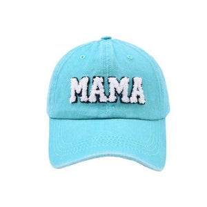 May include: A turquoise blue baseball cap with a white and black embroidered "MAMA" on the front.
