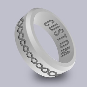 May include: A white silicone ring with a black chain design and the word "CUSTOM" engraved on the side.