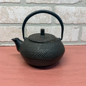 May include: A rustic wooden sign with the text "Welcome to our home" in white lettering. The sign features a distressed finish and a simple, inviting design, perfect for front door decor.