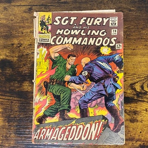 May include: A vintage comic book cover featuring Sgt. Fury and his Howling Commandos. The cover art depicts a battle scene with a soldier in green fighting a Nazi soldier in blue. The title "Sgt. Fury and his Howling Commandos" is in red and yellow lettering. The comic book is issue number 29 and is titled "Armageddon!"