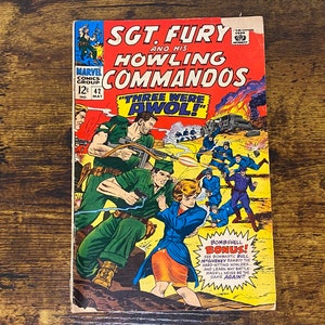 May include: A vintage comic book cover featuring Sgt. Fury and his Howling Commandos. The cover is red, yellow, and blue with a graphic illustration of soldiers in combat. The title "Three Were AWOL!" is printed in a large font.