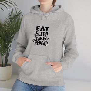 Eat Sleep Hockey Repeat Unisex Heavy Blend Hooded Sweatshirt, Hockey Hoodie, Hockey Fans Gifts, Hockey Shirt For Her Him