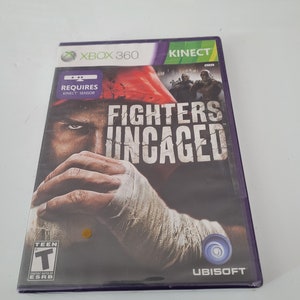 May include: Xbox 360 game case for Fighters Uncaged, a fighting game that requires a Kinect sensor. The cover features a close-up of a man's face with a bandage on his hand, and the game's title is in large, white letters. The game is rated T for Teen by the ESRB and is published by Ubisoft.