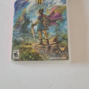 May include: Dragon Quest III HD-2D Remake game case for Nintendo Switch. The cover art features a character with a sword and shield standing on a cliff, with a castle in the background. The game is rated Everyone 10+.