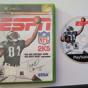 May include: A green and black Xbox game case for ESPN NFL 2K5. The front of the case features a football player wearing a green jersey with the number 81. The text "ESPN NFL 2K5" is printed in white on a red background.