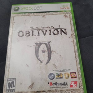 May include: Xbox 360 game case for The Elder Scrolls IV: Oblivion. The case is white with a brown border and features the game's logo and title. The game is rated M for Mature by the ESRB.
