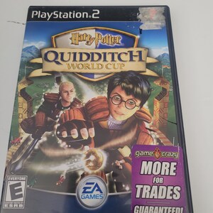 May include: A PlayStation 2 video game case featuring Harry Potter Quidditch World Cup. The cover art shows Harry Potter flying on a broomstick with a golden snitch in his hand. The game is rated E for Everyone by the ESRB. The case also has a sticker that says "game crazy more for trades guaranteed!"